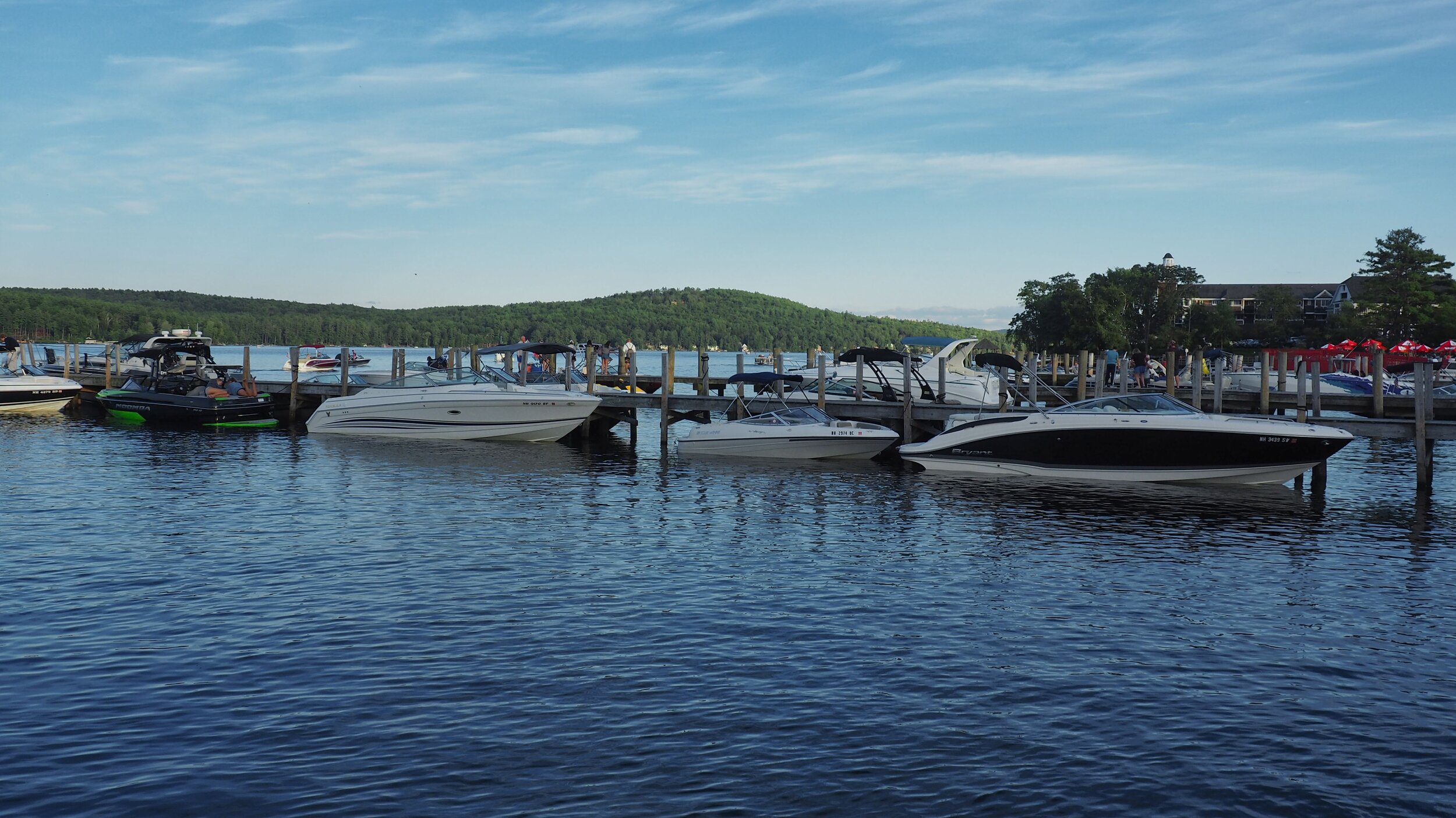 Boats waiting in line to be loaded onto trailers.