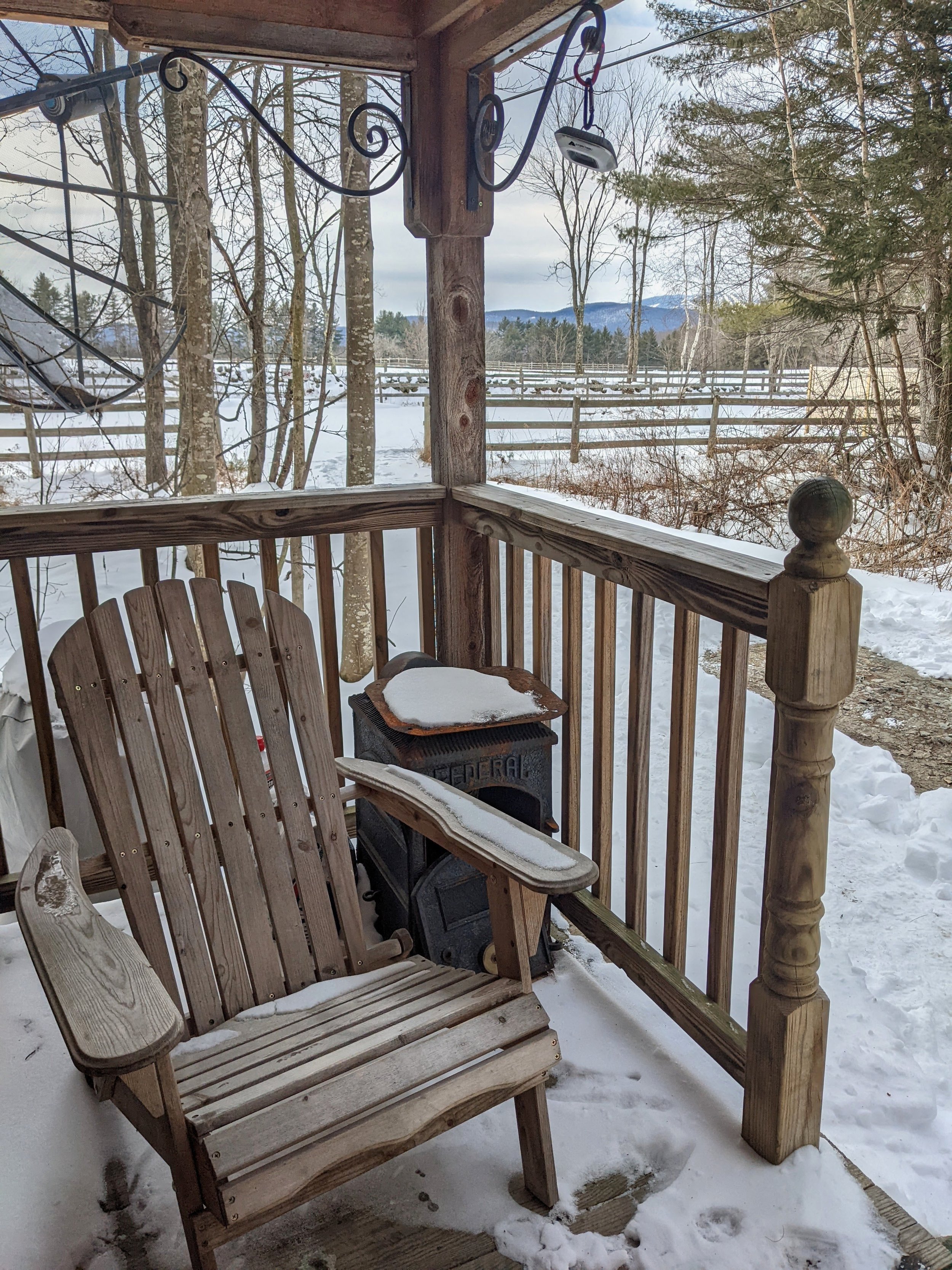 snowy porch cabin in the woods